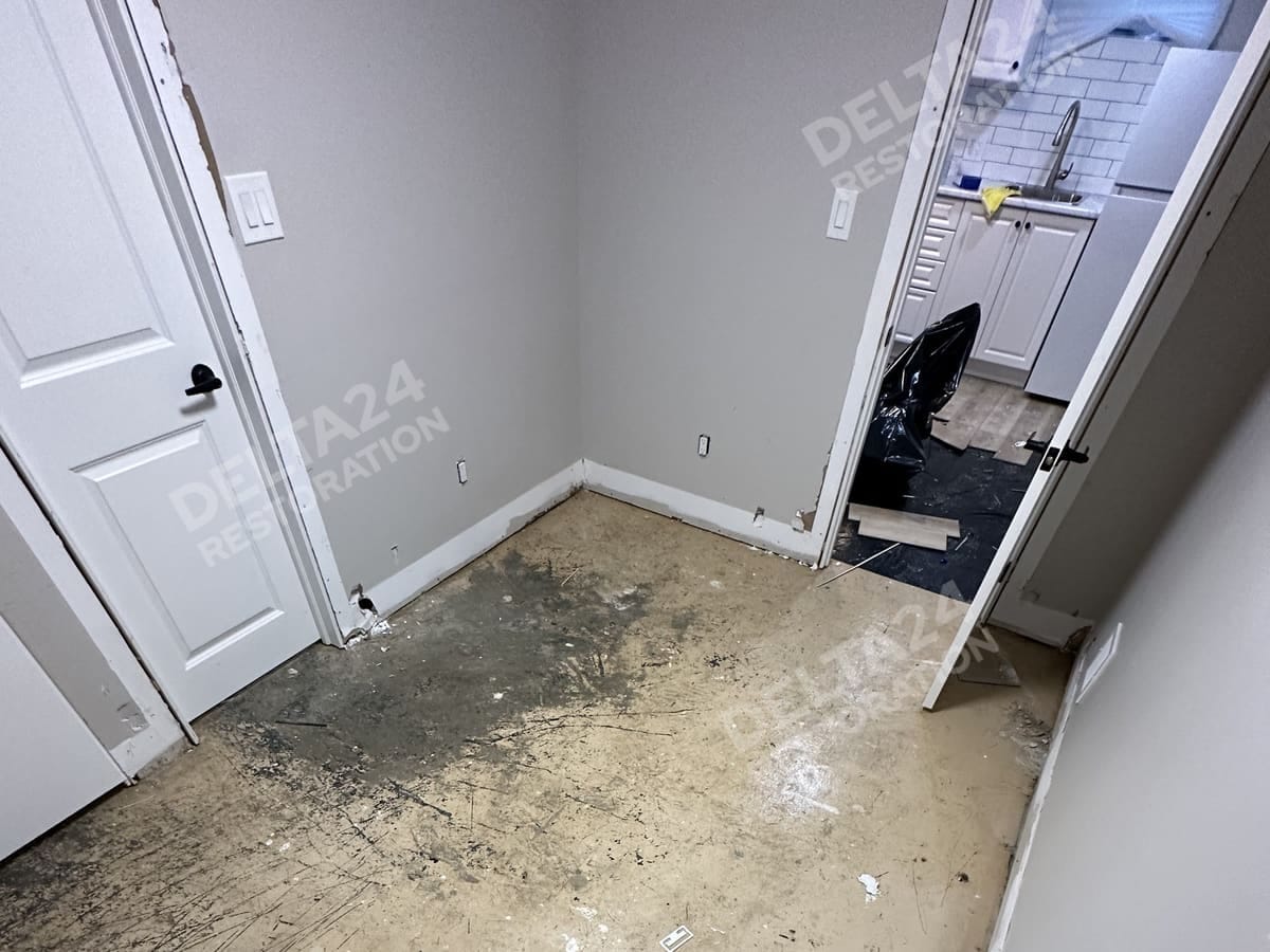 A second room, cleared to the slab and ready to dry