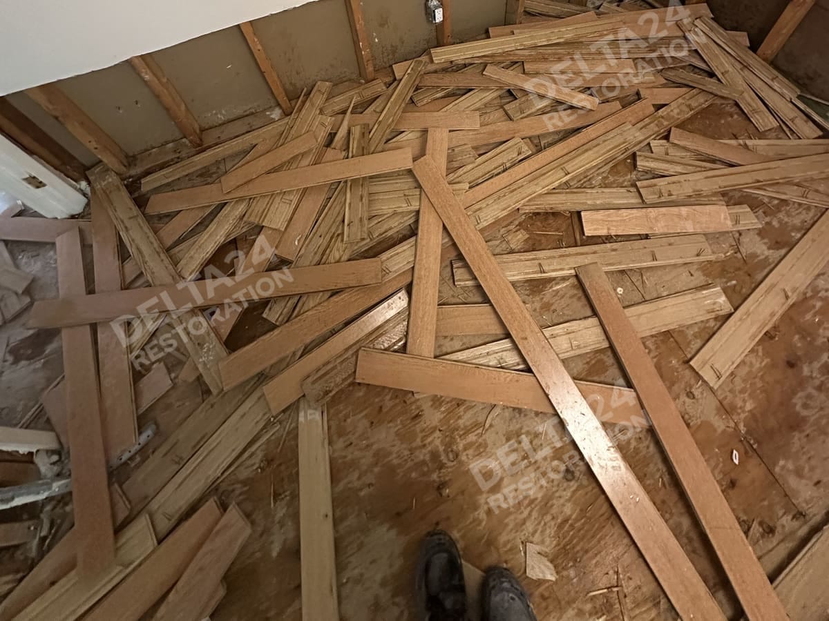 Wet hardwood pulled up in one of the bedrooms