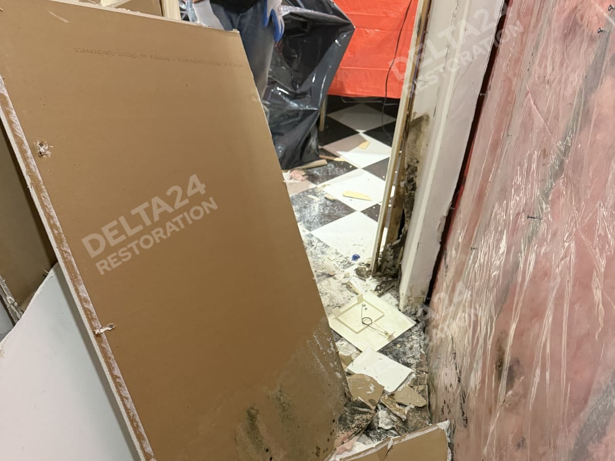 Drywall coming off the wall to expose the insulation